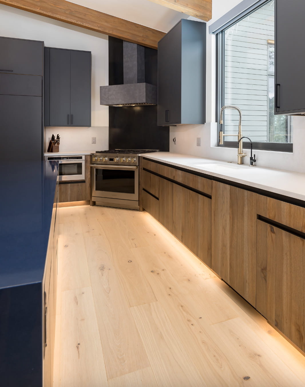 Interior view featuring Classic Bianca hardwood flooring demonstrating how lighter tones visually expand a room in designer flooring selection.
