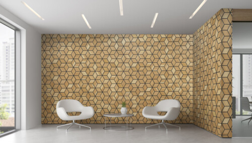 A modern interior featuring a hexagon-patterned wall, two white chairs, and a small glass coffee table in a bright space.